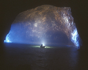 kayakers in painted cave inner chamber